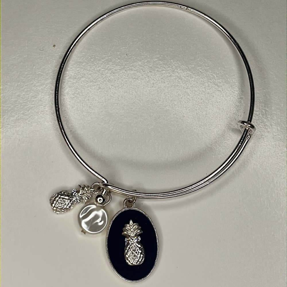 Lightweight silver pineapple and pearl bangle bracelet.